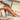 naturecell-bodyoil-paa-strand-med-ben